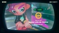 Agent 8 being awarded the Inkling Boy (Green) mem cake upon completing the station