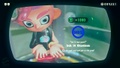 Agent 8 being awarded the Li'l Max mem cake upon completing the station.