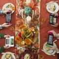 Advertisement showing featuring two 3DS consoles at a Thanksgiving dinner table