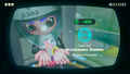 Agent 8 being awarded the Tentacle mem cake upon completing the station.