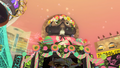 The Inkopolis Plaza tanuki statue with colored eggs and a flower crown