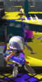 An Octoling throwing the Angle Shooter to mark an enemy.