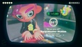 Agent 8 being awarded the Squid Bumper mem cake upon completing the station