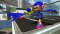 A blue girl inkling playing with a Splattershot on Urchin Underpass