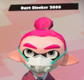 A close up view of a male Inkling wearing the Dust Blocker 2000.