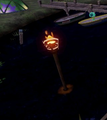A lit torch at Camp Triggerfish.