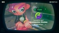 Agent 8 being awarded the Marie mem cake upon completing the station.