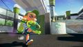 A male Inkling wearing the Blue Slip-Ons runs with a Wasabi Splattershot.