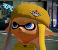 Close-up of an Inkling girl wearing the CoroCoro Cap.