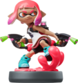 The Inkling Girl amiibo holds the Splat Dualies