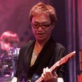 Takashi "DORA" Sawagashira (guitar)