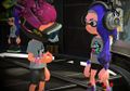 Three Inklings sporting the generic Splatfest Tee design. Note how the wristbands match each Inkling's ink color.