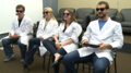 The members of the Squid Research Lab wearing similar lab coats.