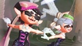 The Squid Sisters performing in their standard costumes