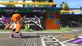 A female Inkling standing in front of stickers of gear brands on the walls.