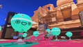 An inkling using the Custom Jet Squelcher while surrounded by Super Chump balloons.