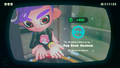 Agent 8 being awarded the Octoling mem cake upon completing the station