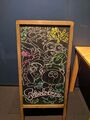 Chalkboard drawing featuring Bisk, Sheldon, Flow and Craymond, and Jelfonzo