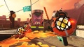 Players wearing the lifesaver ink tank used in Salmon Run, wielding Golden Eggs.