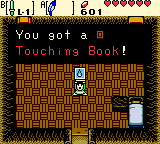 File:Zelda Ages Trading Touching Book.png