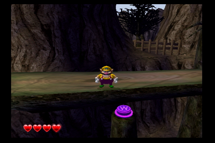 File:Wario World Greenhorn Forest Purple Button.png