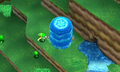 A promotional screenshot featuring Link using the Water Rod