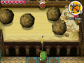 Link attempting to hit an Eyeball Switch by firing an Arrow between the boulders as they pass by