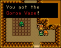 Link receiving the Goron Vase in Oracle of Ages.