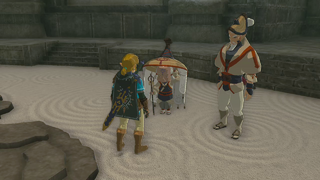 A screenshot of Link, Impa, and Cado inside the Floor Map room.
