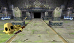 A screenshot of the Entry Hall. The remains of a Fallen Adventurer can be seen on the left.