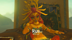 A screenshot of Riju in the Royal Palace's Throne Room. Text on-screen displays her name, along with the title "Gerudo Chief".