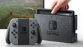 Promotional image showing a docked Switch and a Joy-Con Grip