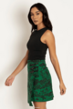 A model wearing a Hyrule Map Green Buckle Wrap A-Line Skirt