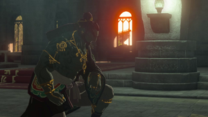 A screenshot of Ganondorf kneeling to Rauru.