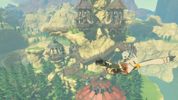 A screenshot of Teba flying away from Rito Village, with Tulin riding on his back.
