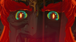 A screenshot of Demon King Ganondorf's face. His eyes have transformed, now resembling the Demon Dragon's.