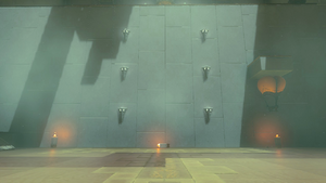 A screenshot of the wall on the second level of the Shrine. Three Candles sit along the wall while a Balloon floats over the Candle to the right.