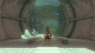 A screenshot of Link standing in the entrance to the Yansamin Shrine. His equipment has been stripped from him.