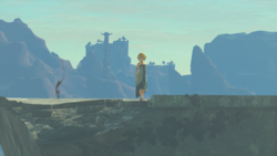 A screenshot of a figure that appears to be Princess Zelda standing on a ruined wall at the edge of Hyrule Castle.