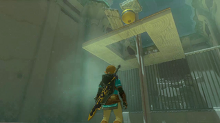 A screenshot of Link using a buoyant Float to bash through a Board blocking the rail structure in the final room.