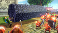 Link en train de soulever une grosse colonne de pierre dans Hyrule Warriors. A noter que normalement, seuls les gantelets d'or sont assez puissants pour lui conférer une telle force.